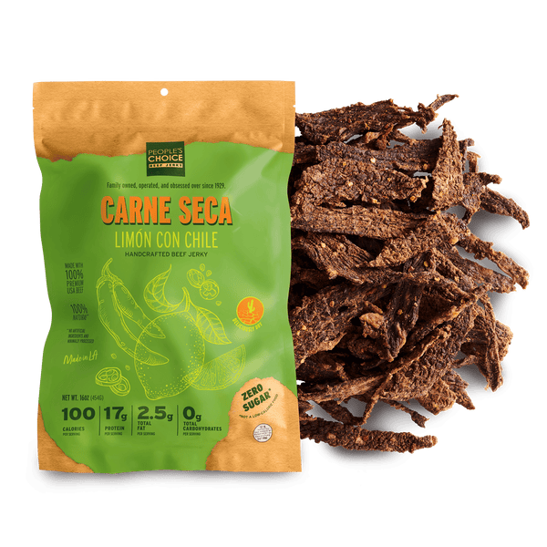 Packaged Carne Seca with lemon and chili flavor next to a pile of dried beef jerky on a green background