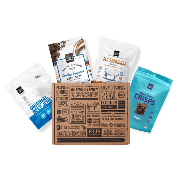 A curated snack box set featuring a central kraft cardboard subscription box surrounded by four branded snack pouches: Original Beef Jerky, Country-Raised Beef Jerky, Old Fashioned Chocolate Chip Cookie, and Beef Jerky Crisps.